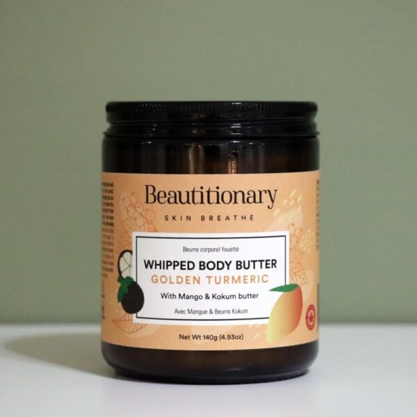Golden Turmeric Whipped Body Butter displayed in a glass jar, featuring a soft whipped texture and nourishing blend of turmeric, rose, and plant butters for smooth, hydrated skin.