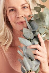 mature-woman-face-skincare-plants